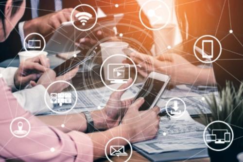Digital icons representing various forms of communication (such as WiFi, email, video, and chat bubbles) float around them.